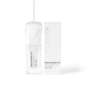 white bottle containing facial serum